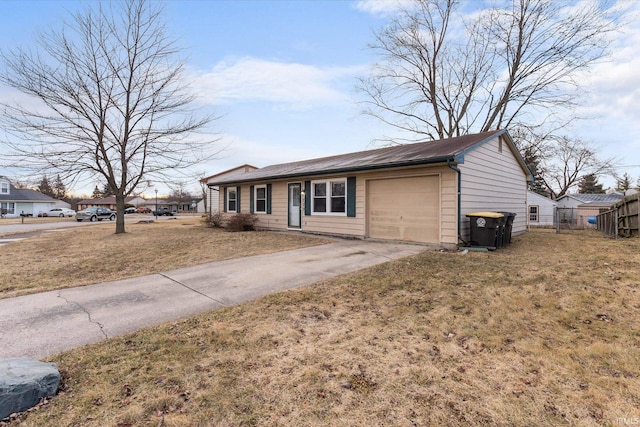 ranch-style house with a garage, concrete driveway, fence, and a front lawn