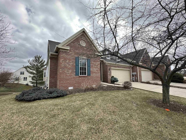 view of front of house featuring an attached garage, brick siding, concrete driveway, crawl space, and a front yard