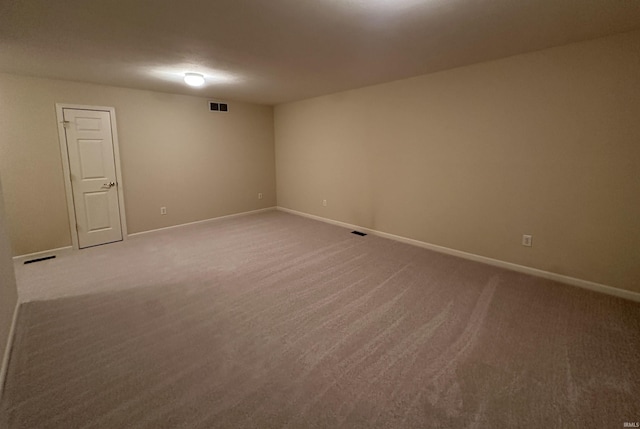 unfurnished room with visible vents and baseboards