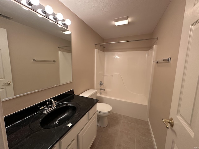 full bathroom with bathing tub / shower combination, toilet, vanity, a textured ceiling, and tile patterned floors