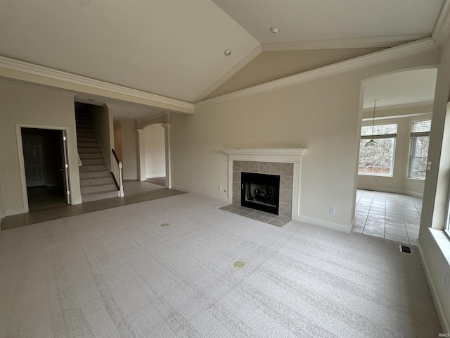 unfurnished living room with baseboards, stairway, crown molding, carpet flooring, and a fireplace