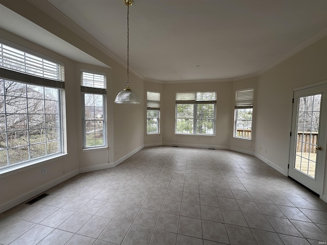 unfurnished room with tile patterned floors, baseboards, visible vents, and ornamental molding