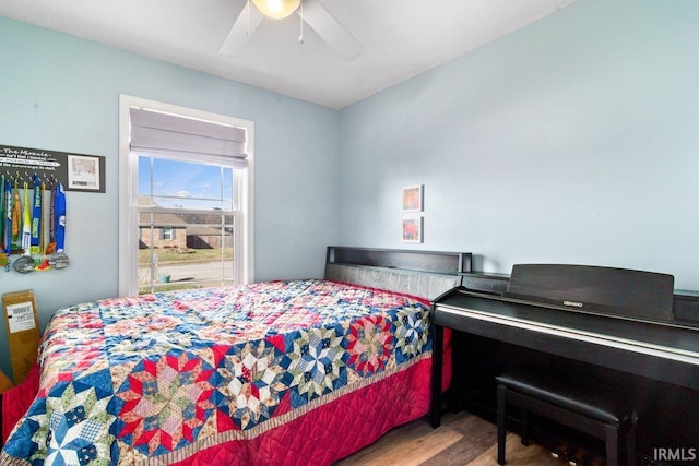 bedroom featuring ceiling fan and wood finished floors