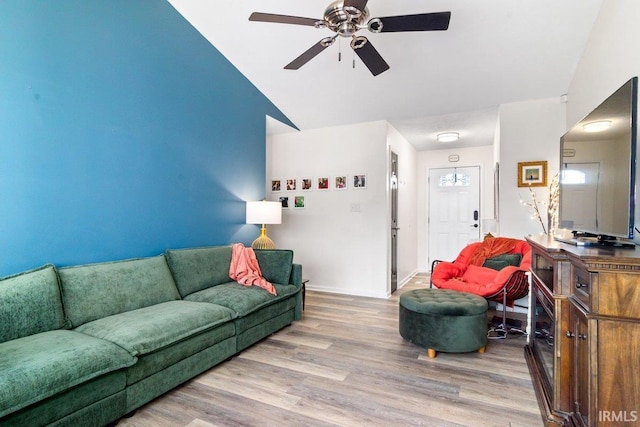 living area with ceiling fan and wood finished floors