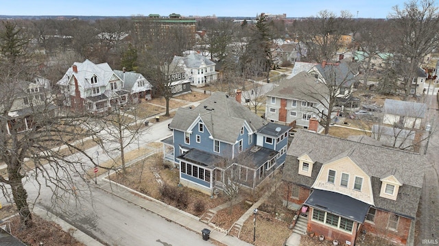 birds eye view of property with a residential view