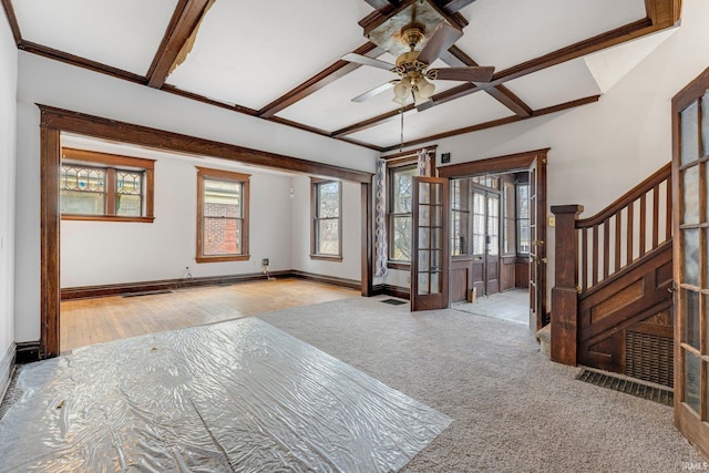 interior space with french doors, a baseboard heating unit, wood finished floors, baseboards, and stairs