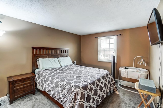 carpeted bedroom featuring a textured ceiling