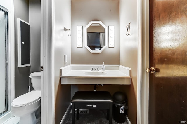 bathroom with a sink and toilet