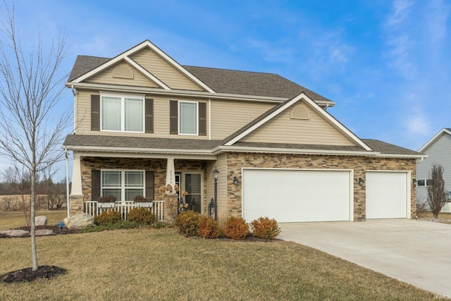 craftsman house with an attached garage, covered porch, concrete driveway, stone siding, and a front lawn