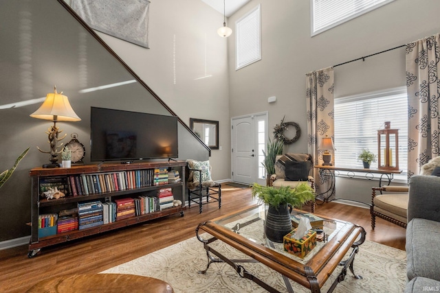 living room featuring baseboards and wood finished floors