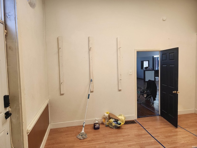 interior space featuring baseboards and wood finished floors