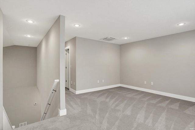 empty room featuring carpet, visible vents, baseboards, and recessed lighting