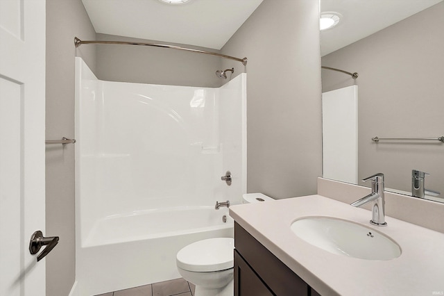 bathroom featuring  shower combination, tile patterned flooring, vanity, and toilet