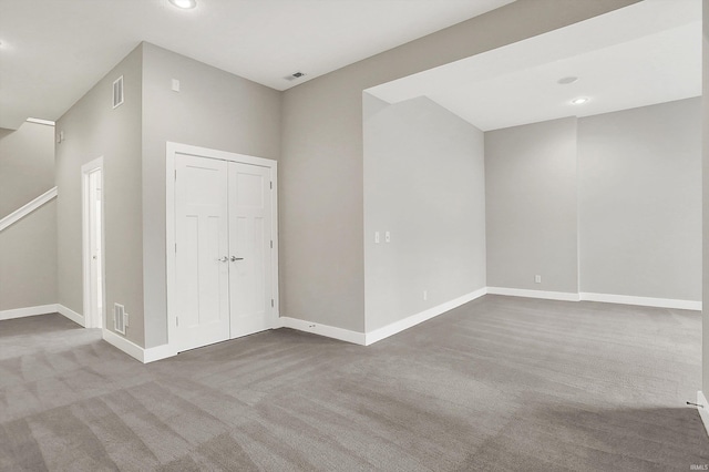 unfurnished bedroom with carpet floors, recessed lighting, a closet, visible vents, and baseboards