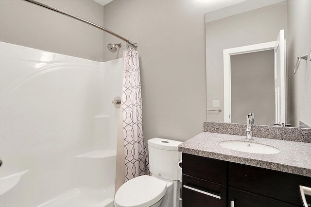 full bathroom with toilet, vanity, and a shower with shower curtain