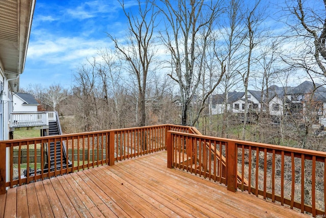 wooden terrace with a residential view