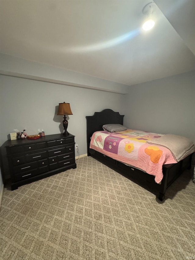 carpeted bedroom featuring baseboards