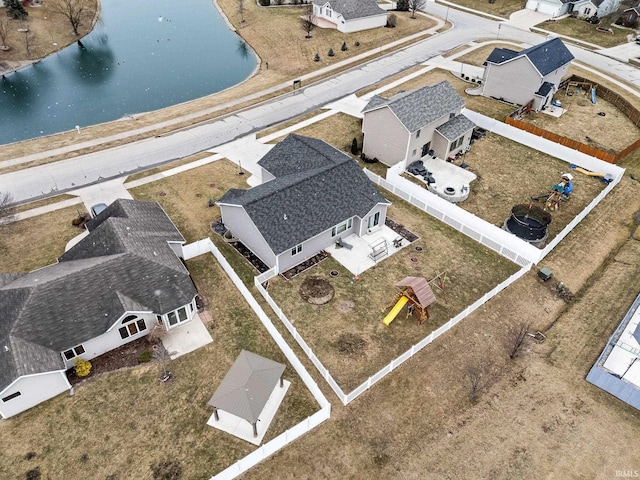 aerial view featuring a residential view and a water view