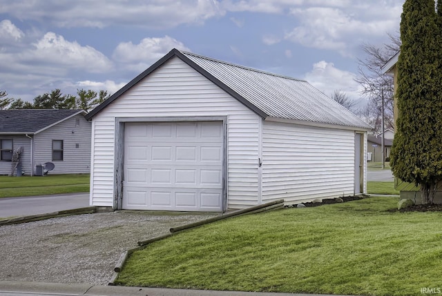 detached garage featuring driveway