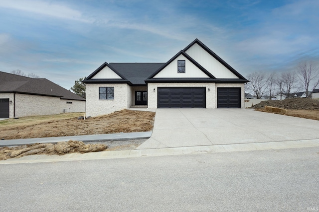 modern inspired farmhouse with concrete driveway and brick siding