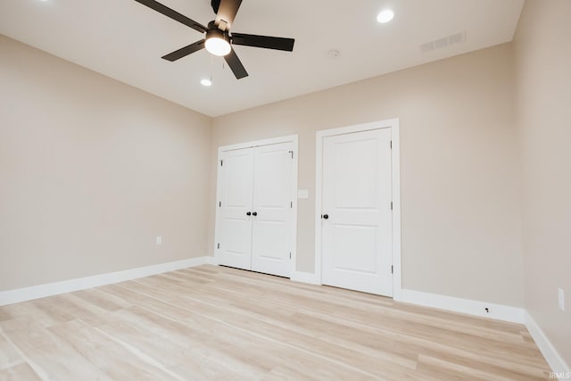 unfurnished bedroom featuring recessed lighting, visible vents, light wood-style flooring, and baseboards