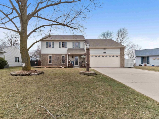 traditional-style home with a garage, driveway, brick siding, and a front lawn