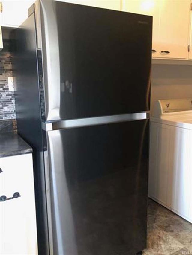 interior space featuring washer / clothes dryer and cabinet space