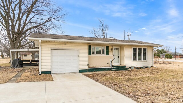 ranch-style home featuring driveway and a garage