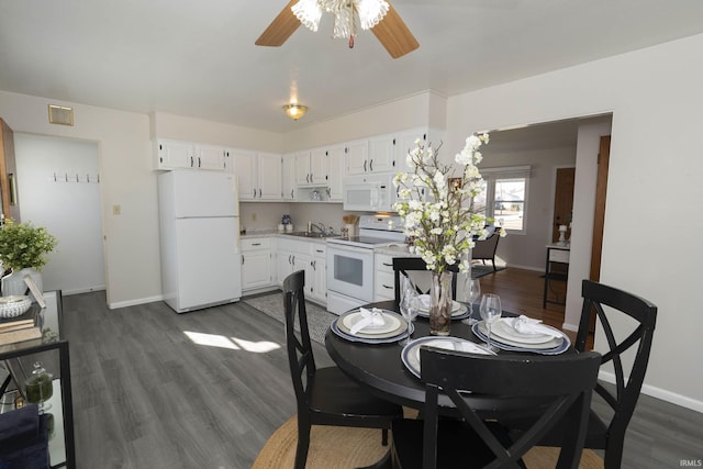 dining room with ceiling fan, dark wood-type flooring, visible vents, and baseboards