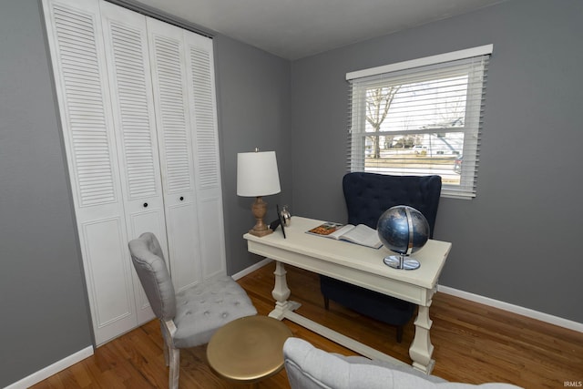 home office with wood finished floors and baseboards