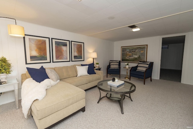 living area featuring carpet flooring and visible vents