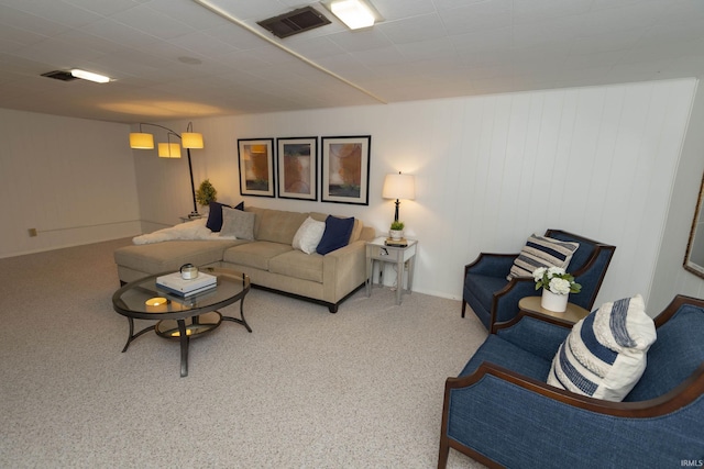 living area featuring carpet and visible vents