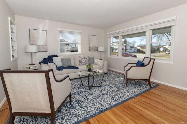 living room featuring baseboards and wood finished floors