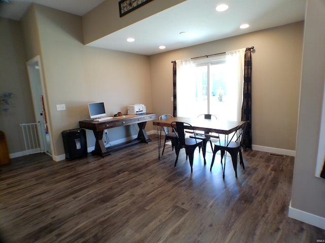 dining space with baseboards, dark wood finished floors, and recessed lighting