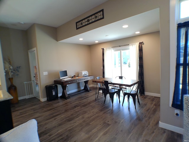 dining space featuring baseboards, wood finished floors, and recessed lighting