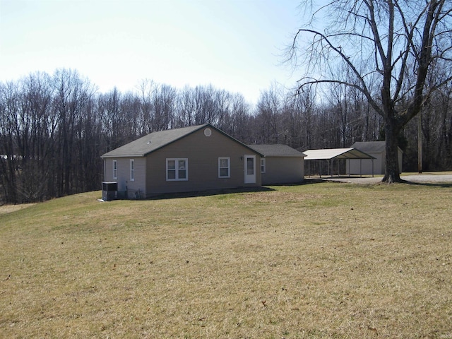 exterior space with a lawn and cooling unit