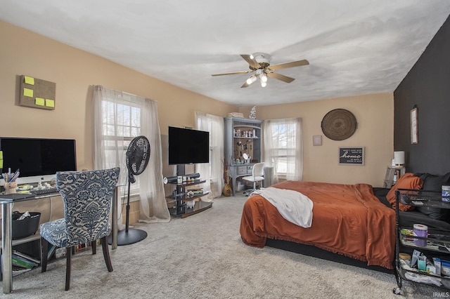 bedroom with ceiling fan and carpet