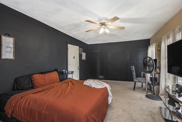 carpeted bedroom with a ceiling fan