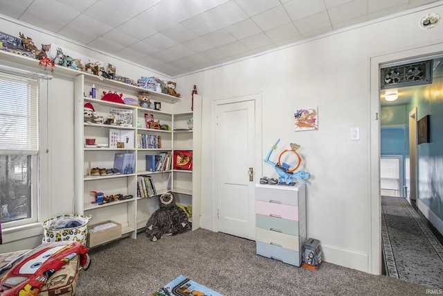 interior space featuring carpet floors and crown molding