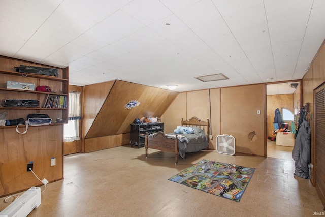 interior space featuring wooden walls, a baseboard heating unit, and tile patterned floors