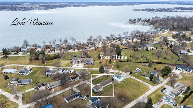 bird's eye view featuring a water view and a residential view