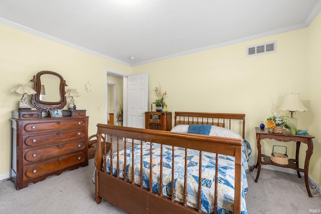 bedroom with crown molding, visible vents, and carpet flooring