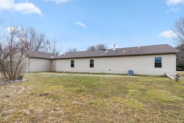 back of property featuring a yard