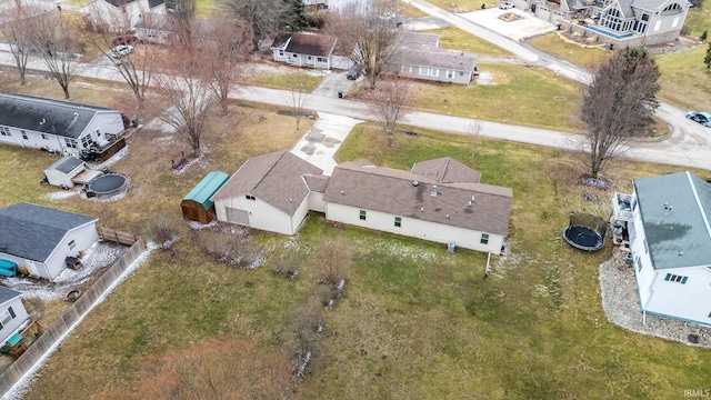 birds eye view of property with a residential view