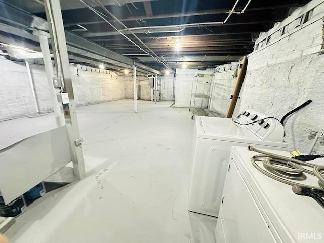 unfinished basement featuring separate washer and dryer