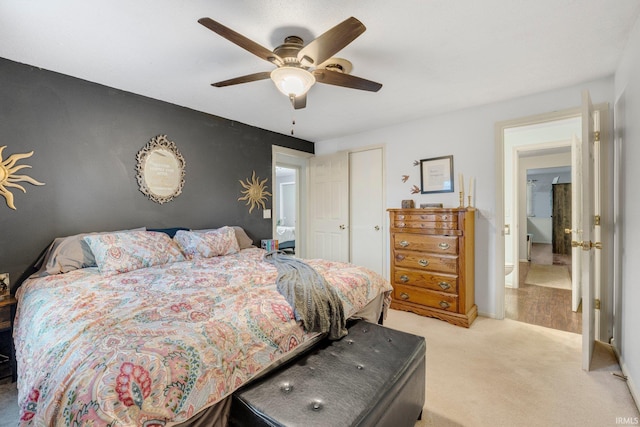 bedroom with ceiling fan, a closet, baseboards, and light colored carpet