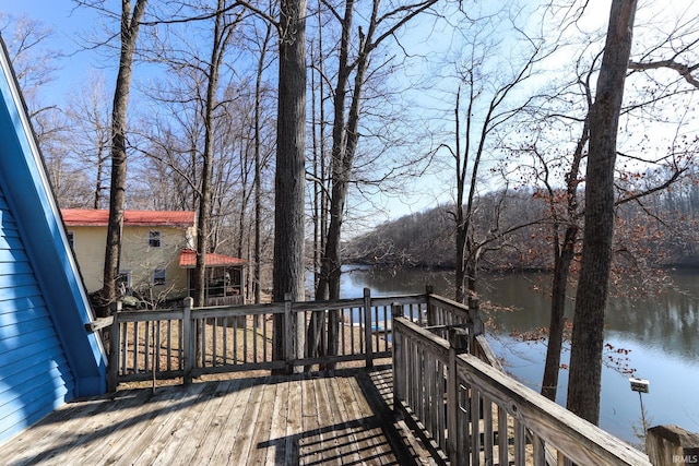 wooden deck featuring a water view