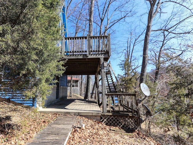 exterior space with stairs and a deck