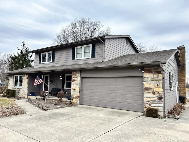 view of front of home with a porch, a garage, stone siding, driveway, and a chimney