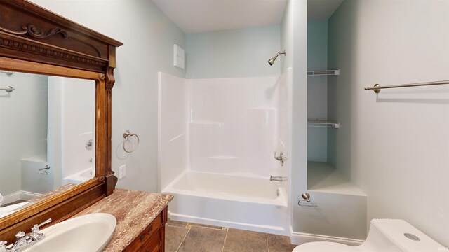 bathroom featuring toilet, shower / tub combination, and vanity